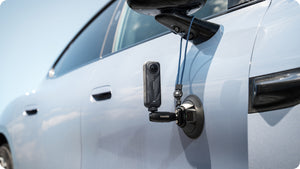 Insta360 Electric Suction Cup Mount vehicle-side mounting example with a separate safety cord, camera and cord sold separately
