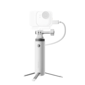 Power handle with tripod legs opened beneath an illustrative camera