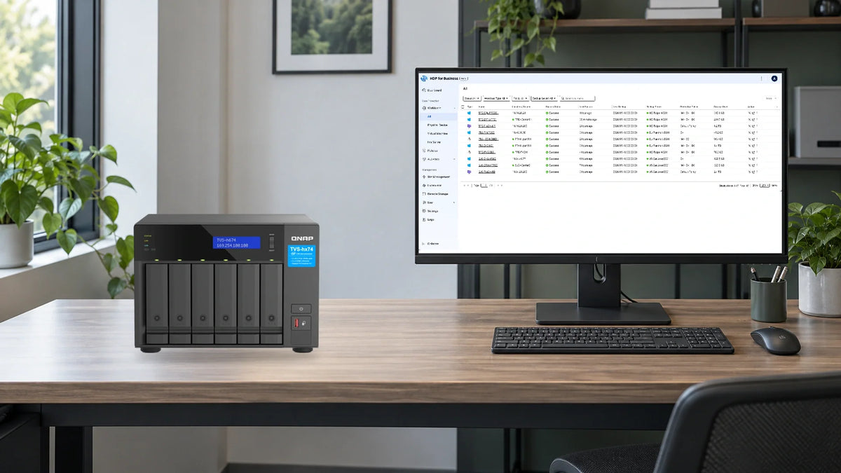 QNAP TVS-h674 beside a workstation showing the HDP for Business backup workload view