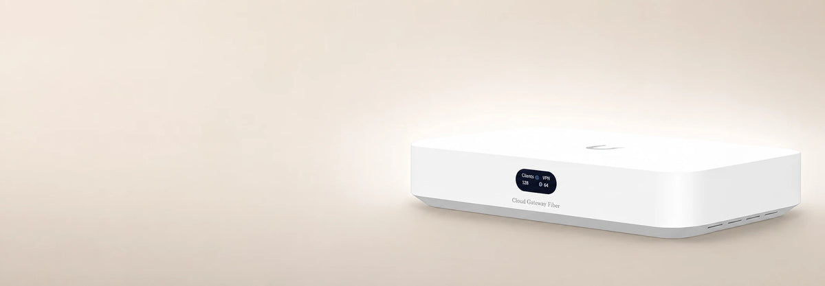 Ubiquiti UniFi Cloud Gateway Fiber on a pale beige background