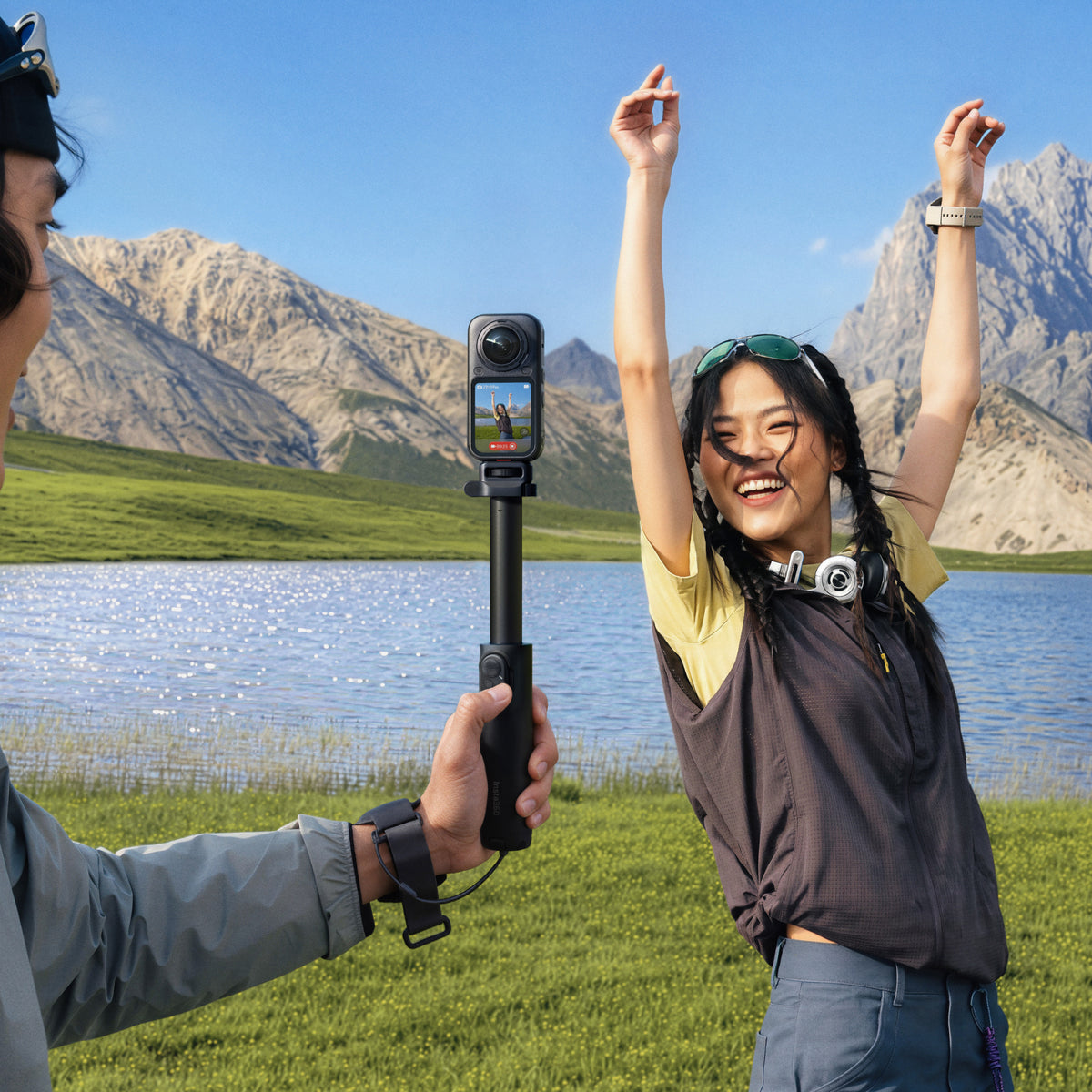 Travel filming setup with a separate 360 camera and selfie stick