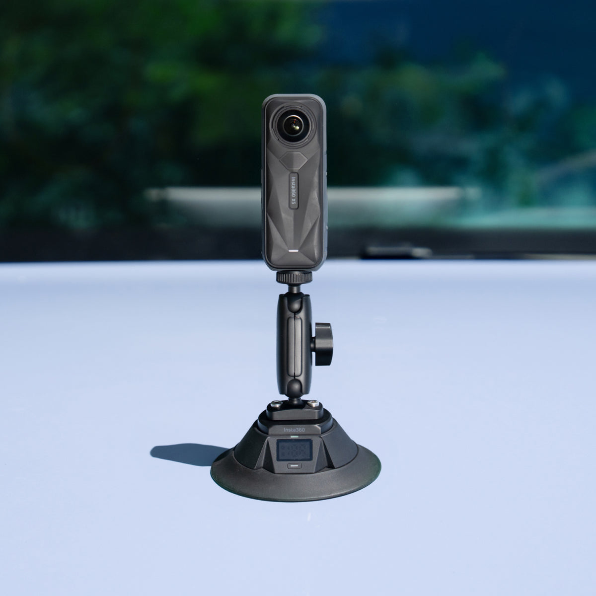 Insta360 Electric Suction Cup Mount camera mounted on a car panel, camera sold separately