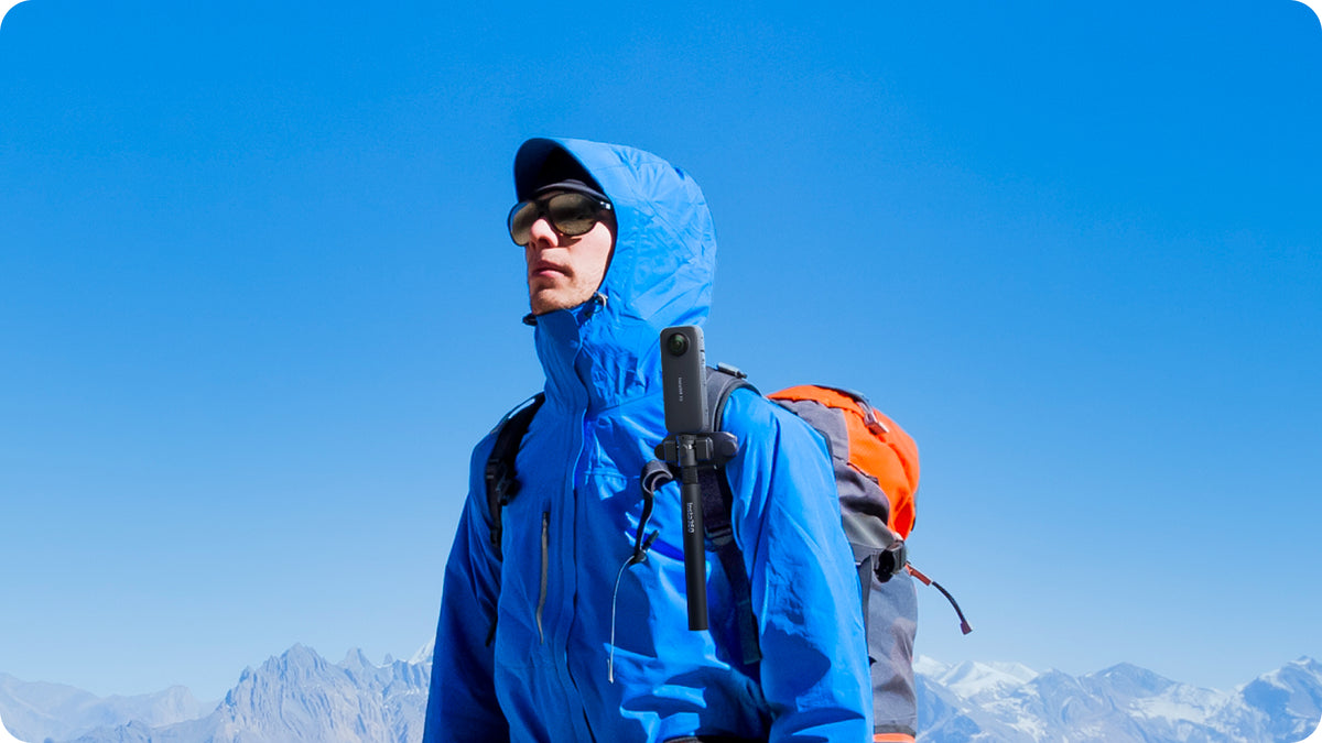 Insta360 Magnetic Selfie Stick Holster manufacturer hiking example with a backpack-mounted camera setup