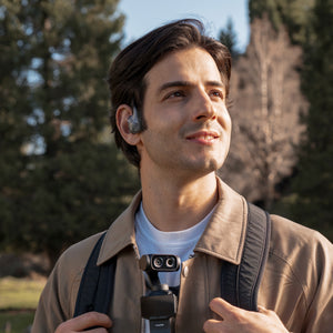 Insta360 POV Head Tracker manufacturer outdoor wearing example with a separate camera and neck mount