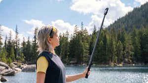 Insta360 X6 Power Selfie Stick extended stick used beside a lake, camera sold separately