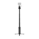 Spin Stick extended with tripod legs opened and an illustrative camera