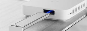 Ubiquiti UACC-SSD-Tray sliding into compatible Cloud Gateway